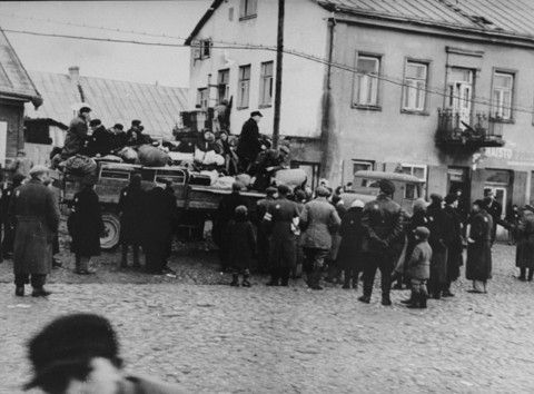 Jews in the Kovno ghetto are boarded onto trucks during a deportation action